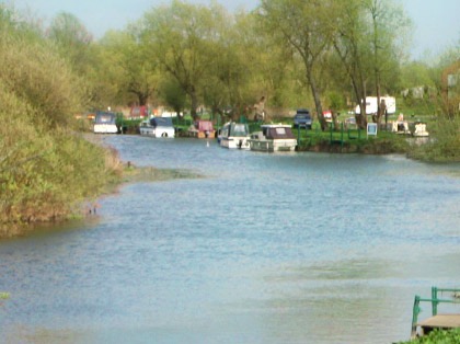 The River Avon at Barton, with boats moored further along the bank